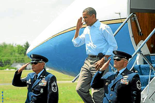 President Barack Obama salutes as he walks off Air Force One at the Bar Harbor Airport in Trenton Friday, July 16, 2010. The President and his family are vacationing on Mount Desert Island this weekend. (Bangor Daily News/Gabor Degre) President Barack Obama salutes as he walks off Air Force One at the Bar Harbor Airport in Trenton Friday, July 16, 2010. The President and his family are vacationing on Mount Desert Island this weekend. (Bangor Daily News/Gabor Degre)