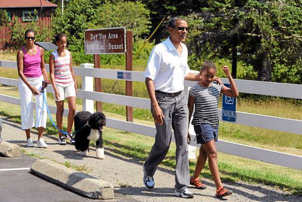 President Barack Obama walks towards the Bass Harbor Head Light with his daughter Sasha,9, (right) as First Lady Michelle Obama walks with Malia, 12, and their dog Bo Saturday afternoon on Mount Desert Island. (Bangor Daily News/Gabor Degre) President Barack Obama walks towards the Bass Harbor Head Light with his daughter Sasha,9, (right) as First Lady Michelle Obama walks with Malia, 12, and their dog Bo Saturday afternoon on Mount Desert Island. (Bangor Daily News/Gabor Degre)