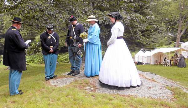 Maine 20th Pvt. Joe Audette and his sweetheart, Kristy Palmer, both of Surry, are joined in a fictional wedded matrimony by Capt. Paul Smith, an Old Town high school teacher, as witnesses Pvt. David Wiley of Madawaska and Liz Gordon of Beverly, Mass., watch on Saturday, July 24, 2010 during the Battle at Fort Knox, a Civil War reenactor event.(Bangor Daily News/Dawn Gagnon) Maine 20th Pvt. Joe Audette and his sweetheart, Kristy Palmer, both of Surry, are joined in a fictional wedded matrimony by Capt. Paul Smith, an Old Town high school teacher, as witnesses Pvt. David Wiley of Madawaska and Liz Gordon of Beverly, Mass., watch on Saturday, July 24, 2010 during the Battle at Fort Knox, a Civil War reenactor event.(Bangor Daily News/Dawn Gagnon)
