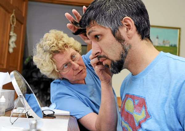 Adam Jewell, right, of LaGrange, gets fitted with a prosthetic eye by Ocularist Ottie Thomas-Smith at her office in Jackson on Friday, July 30, 2010. Jewell lost his eye in May when a friend accidently shot him while turkey hunting in the town of Chester. BANGOR DAILY NEWS PHOTO BY KEVIN BENNETT Adam Jewell, right, of LaGrange, gets fitted with a prosthetic eye by Ocularist Ottie Thomas-Smith at her office in Jackson on Friday, July 30, 2010. Jewell lost his eye in May when a friend accidently shot him while turkey hunting in the town of Chester. BANGOR DAILY NEWS PHOTO BY KEVIN BENNETT