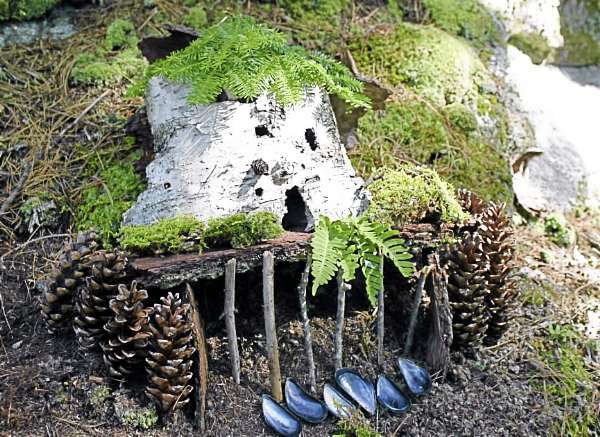 Fairyhouse 2: A fairyhouse decorated with pinecones and mussel shells stands in the fairy village of the Coastal Maine Botanical Gardens in Boothbay after being pieced together by attendees of the Maine Fairy House Festival on Saturday, Aug. 7. (Bangor Daily News/Aislinn Sarnacki) Fairyhouse 2: A fairyhouse decorated with pinecones and mussel shells stands in the fairy village of the Coastal Maine Botanical Gardens in Boothbay after being pieced together by attendees of the Maine Fairy House Festival on Saturday, Aug. 7. (Bangor Daily News/Aislinn Sarnacki)