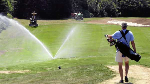 (BANGOR DAILY NEWS PHOTO BY GABOR DEGRE)
CAPTION
A golfer walks down the fairway on the 8th hole at the Island Country Club in Deer Isle Tuesday. The club is expanding, with four holes added and extending the 8th hole. The work is near complete but the rains earlier this Summer pushed back completion. (Bangor Daily News/Gabor Degre) (BANGOR DAILY NEWS PHOTO BY GABOR DEGRE)
CAPTION
A golfer walks down the fairway on the 8th hole at the Island Country Club in Deer Isle Tuesday. The club is expanding, with four holes added and extending the 8th hole. The work is near complete but the rains earlier this Summer pushed back completion. (Bangor Daily News/Gabor Degre)