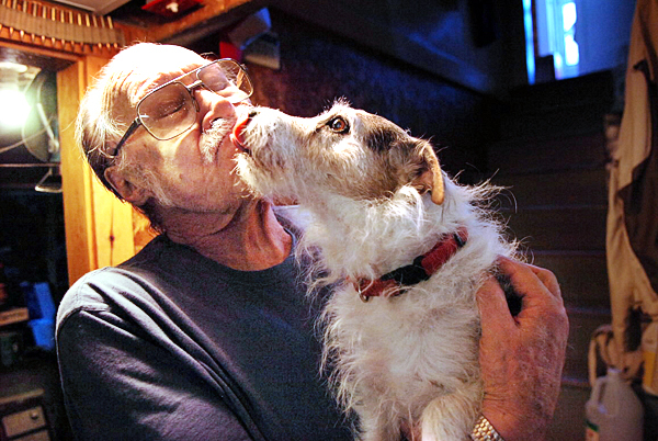 Don Barrett gets some affection from his dog "Buddy" who alerted Barrett to intruders early Monday at 3 a.m. at his home business, Mill Creek Rod & Gun in Orrington which he has run for 30 years. Barrett said Tuesday, Aug. 24, 2010 that the offender or offenders broke in through a basement window and got away with 12 guns. Maine State Police are investigating the burglary. (Bangor Daily News/Bridget Brown) Don Barrett gets some affection from his dog "Buddy" who alerted Barrett to intruders early Monday at 3 a.m. at his home business, Mill Creek Rod & Gun in Orrington which he has run for 30 years. Barrett said Tuesday, Aug. 24, 2010 that the offender or offenders broke in through a basement window and got away with 12 guns. Maine State Police are investigating the burglary. (Bangor Daily News/Bridget Brown)
