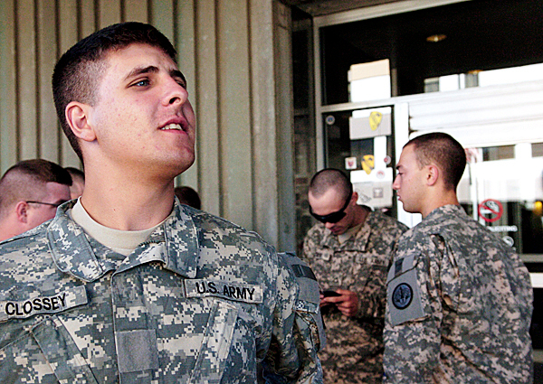 CAPTION
Pvt. Zane Clossey of Robbinston keeps an eye out for family members as he and other other soldiers from the 3rd Amored Regiment in Fort Hood, TX get some fresh air after their troop plane landed at Bangor International Airport Tuesday afternoon, August 24, 2010. (Bangor Daily News/John Clarke Russ) (WEB EDITION PHOTO) CAPTION
Pvt. Zane Clossey of Robbinston keeps an eye out for family members as he and other other soldiers from the 3rd Amored Regiment in Fort Hood, TX get some fresh air after their troop plane landed at Bangor International Airport Tuesday afternoon, August 24, 2010. (Bangor Daily News/John Clarke Russ) (WEB EDITION PHOTO)