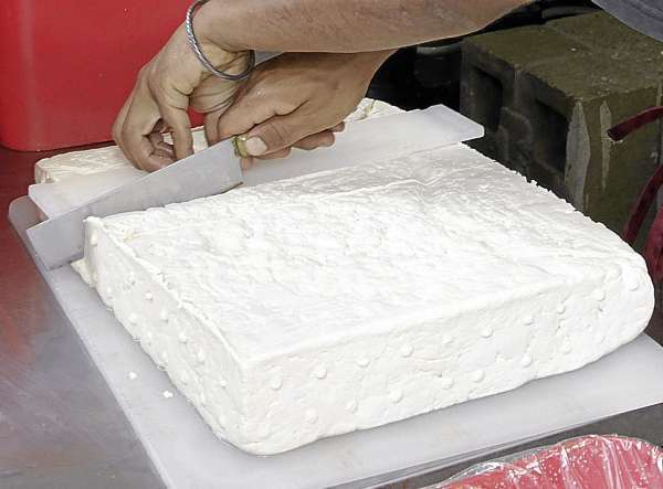 Blocks of cooled compressed tofu are cut up for packaging. About 1000 pounds of tofu are processed each week at the Heiwa Tofu facility in Camden, Maine. (Bangor Daily News/Michael C. York) Blocks of cooled compressed tofu are cut up for packaging. About 1000 pounds of tofu are processed each week at the Heiwa Tofu facility in Camden, Maine. (Bangor Daily News/Michael C. York)