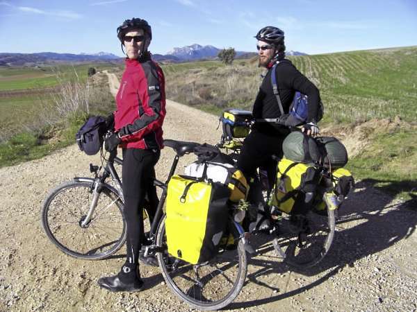 Adrian Cyr, left, and Ellery Althaus stop for a rest on their touring bikes loaded with rear panniers. Any bicycle with a rear rack can hold with panniers, also known as saddlebags. Outfitting your bicycle with a rear rack and panniers doesn't have to be expensive and helps turn your bicycle into a multi-functional mode of transportation that helps a cyclist carry their belongings on the daily commute to work or go grocery shopping. photo by Levi Bridges Adrian Cyr, left, and Ellery Althaus stop for a rest on their touring bikes loaded with rear panniers. Any bicycle with a rear rack can hold with panniers, also known as saddlebags. Outfitting your bicycle with a rear rack and panniers doesn't have to be expensive and helps turn your bicycle into a multi-functional mode of transportation that helps a cyclist carry their belongings on the daily commute to work or go grocery shopping. photo by Levi Bridges