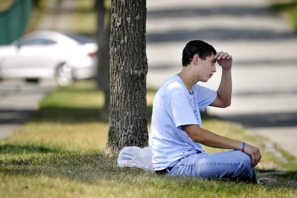 Andrew Turner, 20 0f Bangor wipes his brow in Tuesday afternoon's 90 degree weather as he waits on a curb for a ride home early Tuesday afternoon after working at Pizza Oven on Lincoln Street in Bangor. " It's about 100 degrees near the ovens," said the Turner who helps make pizzas there. " I'd like to think that outside is cooler," he joked. (Bangor Daily News/John Clarke Russ) Andrew Turner, 20 0f Bangor wipes his brow in Tuesday afternoon's 90 degree weather as he waits on a curb for a ride home early Tuesday afternoon after working at Pizza Oven on Lincoln Street in Bangor. " It's about 100 degrees near the ovens," said the Turner who helps make pizzas there. " I'd like to think that outside is cooler," he joked. (Bangor Daily News/John Clarke Russ)