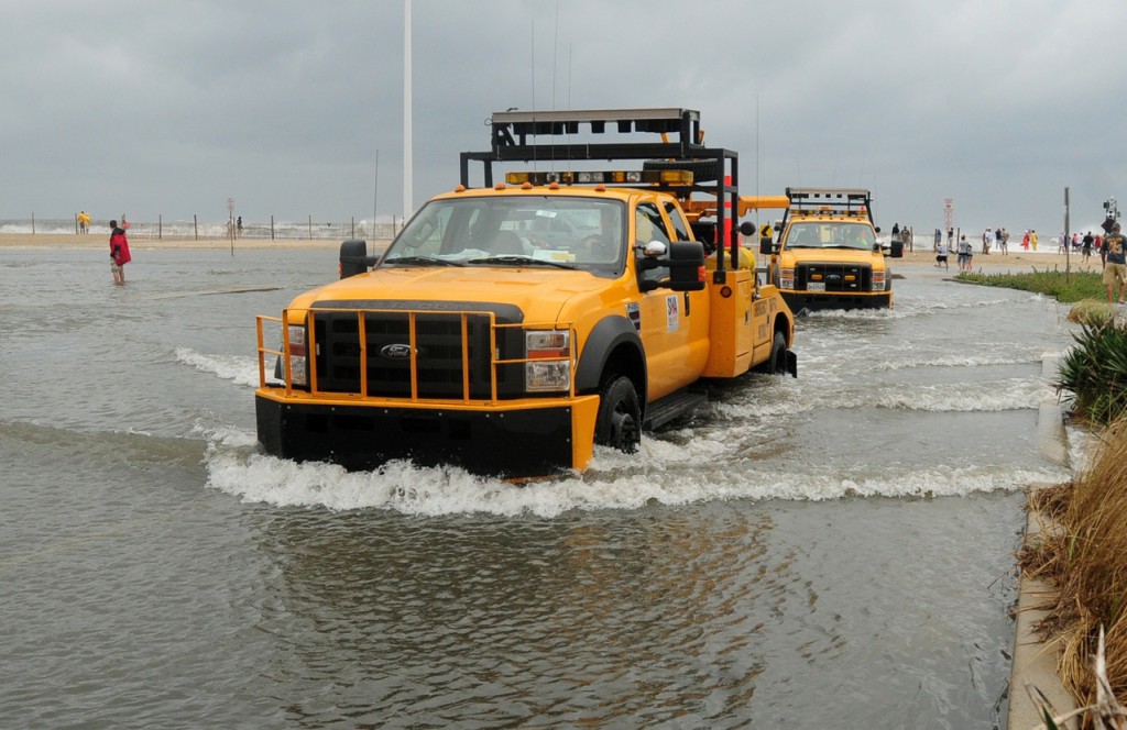 Crew from the Maryland State Highway Administration exit the inlet parking lot after high storm surge from Hurricane Earl covered the area in knee-deep water in Ocean City, Md., on Friday, Sept. 3, 2010. The water was closed to all swimmers due to the rough surf, and beach patrol struggled to keeping onlookers far back on the beach. (AP Photo/ The Salisbury Daily Times, Laura Emmons) Crew from the Maryland State Highway Administration exit the inlet parking lot after high storm surge from Hurricane Earl covered the area in knee-deep water in Ocean City, Md., on Friday, Sept. 3, 2010. The water was closed to all swimmers due to the rough surf, and beach patrol struggled to keeping onlookers far back on the beach. (AP Photo/ The Salisbury Daily Times, Laura Emmons)