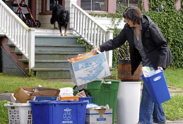 "I'm excited about it," said Brewer resident Gail Ferland of the city's single sort recycling program as she took recyclables to the curb on School Street on Thursday, Sept. 9, 2010. The single sort method allows users to put all their recyclables into one bin or can for pickup. (Bangor Daily News/Scott Haskell) "I'm excited about it," said Brewer resident Gail Ferland of the city's single sort recycling program as she took recyclables to the curb on School Street on Thursday, Sept. 9, 2010. The single sort method allows users to put all their recyclables into one bin or can for pickup. (Bangor Daily News/Scott Haskell)