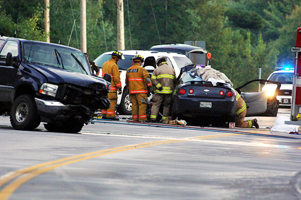 Rescue personnel at the scene of a head-on crash involving a pickup truck and car on Route 1A in Dedham late Tuesday afternoon, Sept. 14, 2010. (Bangor Daily News.Scott Haskell) Rescue personnel at the scene of a head-on crash involving a pickup truck and car on Route 1A in Dedham late Tuesday afternoon, Sept. 14, 2010. (Bangor Daily News.Scott Haskell)