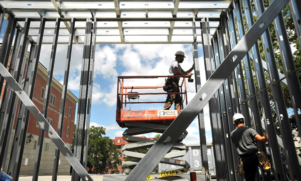 (BANGOR DAILY NEWS PHOTO BY GABOR DEGRE)
CAPTION
Michael Smith (left) and Michael Abbott work on framing up the loading dock of the new Post Office in Bangor Wednesday in the former District Court building. The work is on schedule and the new facility is planned to open in early November. (Bangor Daily News/Gabor Degre) (BANGOR DAILY NEWS PHOTO BY GABOR DEGRE)
CAPTION
Michael Smith (left) and Michael Abbott work on framing up the loading dock of the new Post Office in Bangor Wednesday in the former District Court building. The work is on schedule and the new facility is planned to open in early November. (Bangor Daily News/Gabor Degre)