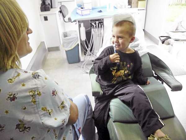 Teresa Alley, of the Washington County Children's Program, presented Wyatt Dupoy, 3, of Machias, with a new toothbrush and a discussion about good dental hygiene Wednesday at the University of Maine. The "Tooth Ferry," a mobile dental unit, appeared at the Early Childhood Center and will be offering free dental care for Machias school children and adults from October 4 to 9 at the Lee Pellon Event Center on Rt. 1. The project pairs the New York University College of Dentistry student outreach program with Delta Dental of Maine to bring the services to Machias. BANGOR DAILY NEWS PHOTO BY SHARON KILEY MACK Teresa Alley, of the Washington County Children's Program, presented Wyatt Dupoy, 3, of Machias, with a new toothbrush and a discussion about good dental hygiene Wednesday at the University of Maine. The "Tooth Ferry," a mobile dental unit, appeared at the Early Childhood Center and will be offering free dental care for Machias school children and adults from October 4 to 9 at the Lee Pellon Event Center on Rt. 1. The project pairs the New York University College of Dentistry student outreach program with Delta Dental of Maine to bring the services to Machias. BANGOR DAILY NEWS PHOTO BY SHARON KILEY MACK