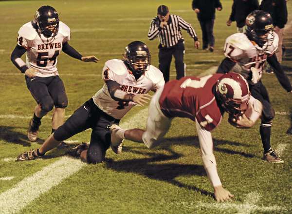 Bangor's Joe Seccareccia is knocked out of bounds by Brewer's Brody Valley (4) while being pursued by Brewer's Adam Lufkin, #51, and Anthony Jackson,#17, during first-quarter action at Bangor on Friday night, October 22, 2010. (Bangor Daily News/Kevin Bennett) Bangor's Joe Seccareccia is knocked out of bounds by Brewer's Brody Valley (4) while being pursued by Brewer's Adam Lufkin, #51, and Anthony Jackson,#17, during first-quarter action at Bangor on Friday night, October 22, 2010. (Bangor Daily News/Kevin Bennett)