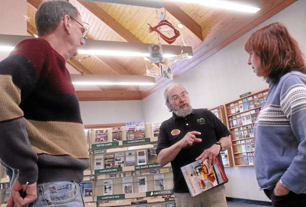 HAMPDEN, ME -- OCTOBER 5, 2010 -- At the northbound Hampden vistiors center, Bill Nadeau, travel counselor for the Maine Tourism Association, talks with Len and Lynette Seader of New Jersey about plans for their first visit to Bar Harbor. The north and southbound Hampden visitor information centers have welcomed more than 3.2 million visitors since their opening 20 years ago. They will celebrate their 20th anniversary on Thursday. PHOTO BY LINDA COAN O'KRESIK HAMPDEN, ME -- OCTOBER 5, 2010 -- At the northbound Hampden vistiors center, Bill Nadeau, travel counselor for the Maine Tourism Association, talks with Len and Lynette Seader of New Jersey about plans for their first visit to Bar Harbor. The north and southbound Hampden visitor information centers have welcomed more than 3.2 million visitors since their opening 20 years ago. They will celebrate their 20th anniversary on Thursday. PHOTO BY LINDA COAN O'KRESIK