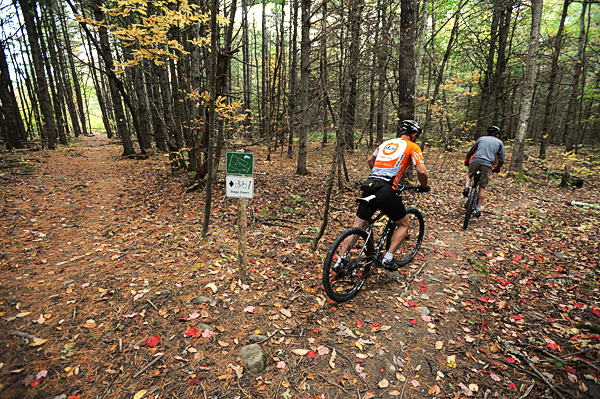 Bikers head right after stopping at one of the new signs along a trail in the Northeast Penjajawoc Preserve in Bangor on Wednesday, October 8, 2010. New signage along with bog bridges have been recently installed. Maps of the area are also available trailside. The trail starts on the left just before the end of the Kittredge Road in Bangor (Bangor Daily News/Kevin Bennett) Bikers head right after stopping at one of the new signs along a trail in the Northeast Penjajawoc Preserve in Bangor on Wednesday, October 8, 2010. New signage along with bog bridges have been recently installed. Maps of the area are also available trailside. The trail starts on the left just before the end of the Kittredge Road in Bangor (Bangor Daily News/Kevin Bennett)