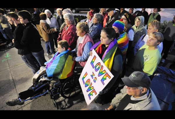 Abut 100 people gathered at West Market Square in Bangor to show their support for the gay, lesbian, bysexual and transgender community Monday on National Coming Out Day. (Bangor Daily News/Gabor Degre) Abut 100 people gathered at West Market Square in Bangor to show their support for the gay, lesbian, bysexual and transgender community Monday on National Coming Out Day. (Bangor Daily News/Gabor Degre)
