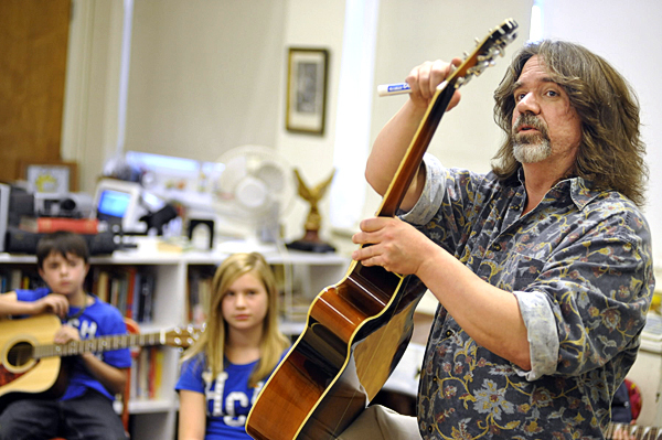 Guitar teacher Robert Donnelly (right) explains the parts of the guitar to a handful of Brewer Middle School fifth-graders during their first guitar class Wednesday afternoon. Behind him were students Matthew Bryant (left) and Mandy Cuskelly. Brewer Middle School and Brewer High School are offering rock'n' roll guitar classes, thanks to a grant from Stephen and Tabitha King. (BANGOR DAILY NEWS PHOTO BY JOHN CLARKE RUSS)
CAP[ION
Guitar teacher Bob Donnelly, right, explained the parts of the guitar to a handful of Brewer Middle School fifth-graders during their first guitar class Wednesday afternoon, Oct. 13, 2010. Behind him were students Matthew Bryant, left, and Mandy Cuskelly. Brewer Middle School and Brewer High School are offering rock and roll guitar classes, thanks to a grant from Stephen and Tabitha King. (Bangor Daily News/John Clarke Russ) Guitar teacher Robert Donnelly (right) explains the parts of the guitar to a handful of Brewer Middle School fifth-graders during their first guitar class Wednesday afternoon. Behind him were students Matthew Bryant (left) and Mandy Cuskelly. Brewer Middle School and Brewer High School are offering rock'n' roll guitar classes, thanks to a grant from Stephen and Tabitha King. (BANGOR DAILY NEWS PHOTO BY JOHN CLARKE RUSS)
CAP[ION
Guitar teacher Bob Donnelly, right, explained the parts of the guitar to a handful of Brewer Middle School fifth-graders during their first guitar class Wednesday afternoon, Oct. 13, 2010. Behind him were students Matthew Bryant, left, and Mandy Cuskelly. Brewer Middle School and Brewer High School are offering rock and roll guitar classes, thanks to a grant from Stephen and Tabitha King. (Bangor Daily News/John Clarke Russ)