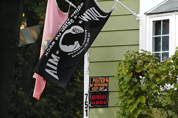 A U.S. Marine Corps flag, a P.O.W-M.I.A. flag, a no trespass sign and dog warning were seen at this 751 Main Street home in Bangor late Sunday morning, Oct. 24, 2010. Police closed down part of Main Street as well as part of the neighborhood near the home during a standoff with a man inside the home Saturday evening, Oct. 23, 2010. The man was taken into custody shortly after midnight and transported to Eastern Maine Medical Center for evaluation. (Bangor Daily News/John Clarke Russ) A U.S. Marine Corps flag, a P.O.W-M.I.A. flag, a no trespass sign and dog warning were seen at this 751 Main Street home in Bangor late Sunday morning, Oct. 24, 2010. Police closed down part of Main Street as well as part of the neighborhood near the home during a standoff with a man inside the home Saturday evening, Oct. 23, 2010. The man was taken into custody shortly after midnight and transported to Eastern Maine Medical Center for evaluation. (Bangor Daily News/John Clarke Russ)