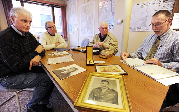 Thomas Birmingham of Windsor, John Birmingham of Old Town, Wilbur Birmingham of Rockland and Robert Birmingham of Durham, all nephews of deceased American flier, Robert J. Birmingham of WInterport, gather around a table at the Belfast office of the Bangor Daily News on Monday, October 25, 2010. The foursome had been looking for more information on their relative Robert Birmingham who was shot down over France in July of 1944. An article in the Weekly, a BDN published paper, got their attention with a story about a French association dedicated to recovering WW II artifacts and honoring fallen American soldiers from the WW II period. (Bangor Daily News/Kevin Bennett) Thomas Birmingham of Windsor, John Birmingham of Old Town, Wilbur Birmingham of Rockland and Robert Birmingham of Durham, all nephews of deceased American flier, Robert J. Birmingham of WInterport, gather around a table at the Belfast office of the Bangor Daily News on Monday, October 25, 2010. The foursome had been looking for more information on their relative Robert Birmingham who was shot down over France in July of 1944. An article in the Weekly, a BDN published paper, got their attention with a story about a French association dedicated to recovering WW II artifacts and honoring fallen American soldiers from the WW II period. (Bangor Daily News/Kevin Bennett)