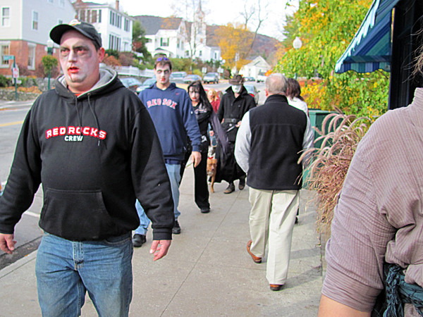 A pack of about a dozen zombies lurching through Camden's downtown on Saturday, Oct. 30, 2010 attracted some curious glances. The attack of the undead was organized as a "flash mob" event, which in big cities are known to stage hundreds or thousands of participants who all participate in some form of performance art or prank. BANGOR DAILY NEWS PHOTO BY CHRISTOPHER COUSINS A pack of about a dozen zombies lurching through Camden's downtown on Saturday, Oct. 30, 2010 attracted some curious glances. The attack of the undead was organized as a "flash mob" event, which in big cities are known to stage hundreds or thousands of participants who all participate in some form of performance art or prank. BANGOR DAILY NEWS PHOTO BY CHRISTOPHER COUSINS