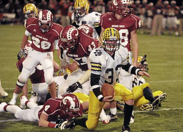Mt. Blue's Matt Davis (33) comes to his feet and starts to celebrate after scoring what would be Mt. Blue's only touchdown against Bangor on Friday, November 5, 2010 at Husson University in Bangor. Bangor won 22-12. (Bangor Daily News/Kevin Bennett) Mt. Blue's Matt Davis (33) comes to his feet and starts to celebrate after scoring what would be Mt. Blue's only touchdown against Bangor on Friday, November 5, 2010 at Husson University in Bangor. Bangor won 22-12. (Bangor Daily News/Kevin Bennett)