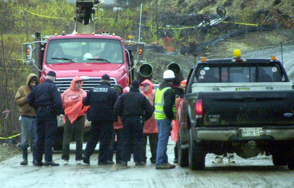 BDN PHOTO BY NICK SAMBIDES JR. Protestors lock arms against traffic at the $130 million Rollins Mountain industrial wind site off Route 6 in Lincoln on Monday. BDN PHOTO BY NICK SAMBIDES JR. Protestors lock arms against traffic at the $130 million Rollins Mountain industrial wind site off Route 6 in Lincoln on Monday.