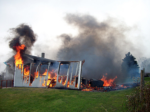 A fire started around 11 a.m. Tuesday at 21 Guptil Lane in Owls Head. According to dispatchers at Knox County Communication, the fire was contained to one garage, but the nearby house received some damage. (Photo courtesy of Gaye Best) A fire started around 11 a.m. Tuesday at 21 Guptil Lane in Owls Head. According to dispatchers at Knox County Communication, the fire was contained to one garage, but the nearby house received some damage. (Photo courtesy of Gaye Best)