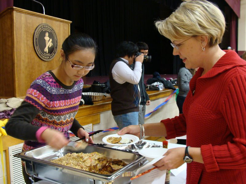 Winnie Li of China, left, parceled out samples of dishes she cooked to Cindy Macdonald of Dover-Foxcroft on Saturday November 20, 2010 at Foxcroft Academy's annual International Culture and Food Festival. About 96 foreign students from eight countries made ethnic dishes they shared with the public. (Bangor Daily News Photo by Diana Bowley) Winnie Li of China, left, parceled out samples of dishes she cooked to Cindy Macdonald of Dover-Foxcroft on Saturday November 20, 2010 at Foxcroft Academy's annual International Culture and Food Festival. About 96 foreign students from eight countries made ethnic dishes they shared with the public. (Bangor Daily News Photo by Diana Bowley)
