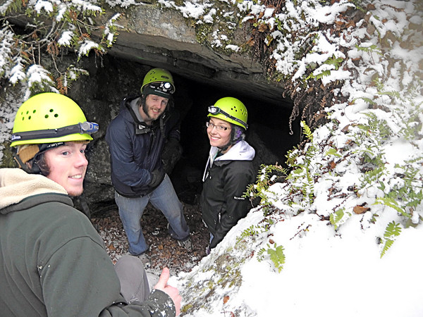 University of Maine at Presque Isle students Gordie Scannell, Adam Dunn and Courtney Cray take a break before entering a Quebec cave during last weekend's OAPI outing. (Photo by Julia Bayly). University of Maine at Presque Isle students Gordie Scannell, Adam Dunn and Courtney Cray take a break before entering a Quebec cave during last weekend's OAPI outing. (Photo by Julia Bayly).