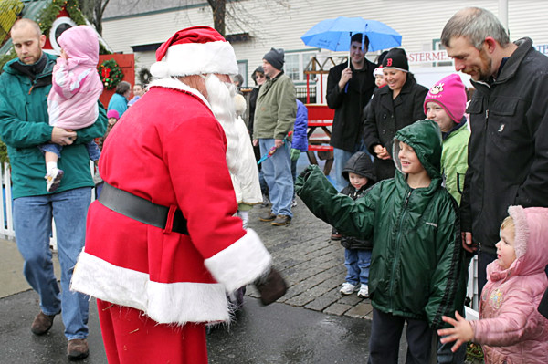 Santa greeted a line of children who waited to sit on his lap and have their pictures taken Friday at the kickoff to Rockland's Festival of Lights. Santa will sit in his temporary home on Main Street from noon- 3 p.m. every Saturday until Christmas. (Bangor Daily News/Heather Steeves) Santa greeted a line of children who waited to sit on his lap and have their pictures taken Friday at the kickoff to Rockland's Festival of Lights. Santa will sit in his temporary home on Main Street from noon- 3 p.m. every Saturday until Christmas. (Bangor Daily News/Heather Steeves)