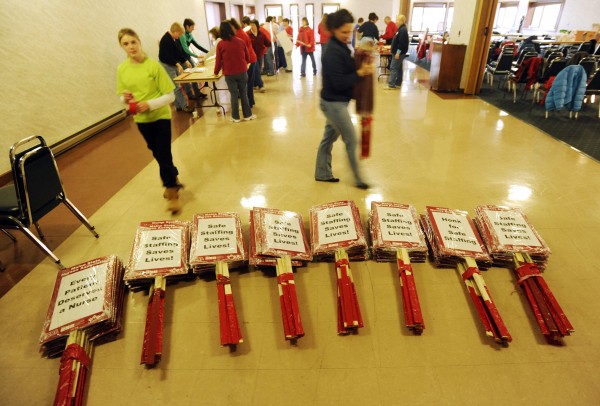 Nurses from Eastern Maine Medical Center in Bangor prepare picket signs in the basement of the Bangor Motor Inn on Saturday. The group has been locked out of the State Street hospital and will picket the campus on Monday. Nurses from Eastern Maine Medical Center in Bangor prepare picket signs in the basement of the Bangor Motor Inn on Saturday. The group has been locked out of the State Street hospital and will picket the campus on Monday.