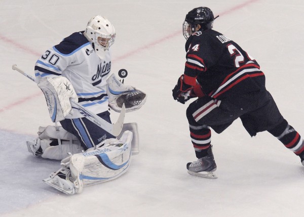 Maine goalie Dan Sullivan (30) makes a point-blank save on Northeastern's Drew Daniels (24) in the first period of their game in Orono, Saturday, Nov. 13, 2010. (BDN Photo by Michael C. York) Maine goalie Dan Sullivan (30) makes a point-blank save on Northeastern's Drew Daniels (24) in the first period of their game in Orono, Saturday, Nov. 13, 2010. (BDN Photo by Michael C. York)