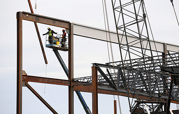 A beam is guided into place on the new Hampden Academy Building Wednesday morning. The work is slightly ahead of schedule due to favorable weather. The new building is scheduled to be complete in 2013. (Bangor Daily News/Gabor Degre) A beam is guided into place on the new Hampden Academy Building Wednesday morning. The work is slightly ahead of schedule due to favorable weather. The new building is scheduled to be complete in 2013. (Bangor Daily News/Gabor Degre)