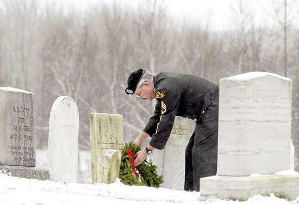 HERMON, ME -- DECEMBER 5, 2010 -- SFC(R) Thomas Copeland, JROTC Army Instructor at Hermon High School, lays wreaths on on the graves of veterans at Snows Corner Cemetery in Hermon on Sunday. Copeland and several other volunteers placed about 330 wreaths at the five Hermon cemeteries following a Wreaths Across America Ceremony at Hermon Elementary School. In 1992, Morrill Worcester, owner of Worcester Wreath in Harrington, Maine, had extra wreaths near the end of the holiday season. Those wreaths were placed in one of the older sections of Arlington National Cemetery, which started Wreaths Across America. Every year since, Worcester has donated wreaths to Arlington National Cemetery to honor our fallen heroes. LINDA COAN O'KRESIK HERMON, ME -- DECEMBER 5, 2010 -- SFC(R) Thomas Copeland, JROTC Army Instructor at Hermon High School, lays wreaths on on the graves of veterans at Snows Corner Cemetery in Hermon on Sunday. Copeland and several other volunteers placed about 330 wreaths at the five Hermon cemeteries following a Wreaths Across America Ceremony at Hermon Elementary School. In 1992, Morrill Worcester, owner of Worcester Wreath in Harrington, Maine, had extra wreaths near the end of the holiday season. Those wreaths were placed in one of the older sections of Arlington National Cemetery, which started Wreaths Across America. Every year since, Worcester has donated wreaths to Arlington National Cemetery to honor our fallen heroes. LINDA COAN O'KRESIK