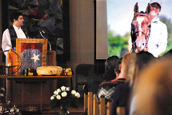 The Rev. Mark Glovin, left, and and congregants watched a memorial slide show for Katrina Windred (pictured on right) during a celebration of her life at First Universalist Church in Rockland Saturday, Dec. 11.2010. The church was filled beyond capacity with family and friends who knew and loved Windred.(Bangor Daily News/John Clarke Russ) The Rev. Mark Glovin, left, and and congregants watched a memorial slide show for Katrina Windred (pictured on right) during a celebration of her life at First Universalist Church in Rockland Saturday, Dec. 11.2010. The church was filled beyond capacity with family and friends who knew and loved Windred.(Bangor Daily News/John Clarke Russ)