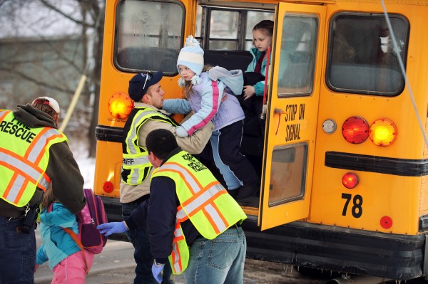 Orrington Fire and Rescue personnel help several of the 38 children from the Center Drive School in Orrington off the emergency exit of a school bus on Thursday, December 16, 2010 at the intersection of Center Drive and Route 15 after the school bus struck a van driven by Nanitalynn (cq) Hardy. Passengers in the van included Edward Hardy, John and Verona Stevens. (Bangor Daily News/Kevin Bennett)
WITH GAGNON STORY: ORRBUSACCI Orrington Fire and Rescue personnel help several of the 38 children from the Center Drive School in Orrington off the emergency exit of a school bus on Thursday, December 16, 2010 at the intersection of Center Drive and Route 15 after the school bus struck a van driven by Nanitalynn (cq) Hardy. Passengers in the van included Edward Hardy, John and Verona Stevens. (Bangor Daily News/Kevin Bennett)
WITH GAGNON STORY: ORRBUSACCI