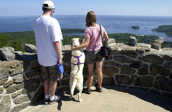 "I ... SAW THREE ISLANDS IN A BAY" Edward and Jennifer Smith from Plattsburg, N.Y., enjoy the view of Camden from the tower on Mount Battie on Monday. Between them is their dog Molly. (BANGOR DAILY NEWS PHOTO BY LINDA COAN O'KRESIK) "I ... SAW THREE ISLANDS IN A BAY" Edward and Jennifer Smith from Plattsburg, N.Y., enjoy the view of Camden from the tower on Mount Battie on Monday. Between them is their dog Molly. (BANGOR DAILY NEWS PHOTO BY LINDA COAN O'KRESIK)