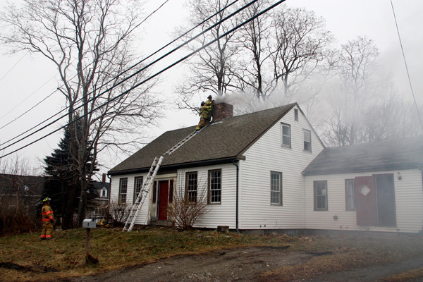Rockland firemen worked for two hours to extinguish a chimney fire that started at about 1 p.m. Wednesday at a residence on Lake Avenue. According to Lt. Jamie Leo, of the Rockland Fire Department, his men had to use chains to reduce soot buildup in the chimney first. After doing that, the firefighters were able to toss a dry chemical extinguisher into the chimney. No one was injured and the house was undamaged. Leo said people should have their chimneys cleaned at least once per year to avoid buildup. PHOTO COURTESY ROCKLAND FIRE DEPARTMENT Rockland firemen worked for two hours to extinguish a chimney fire that started at about 1 p.m. Wednesday at a residence on Lake Avenue. According to Lt. Jamie Leo, of the Rockland Fire Department, his men had to use chains to reduce soot buildup in the chimney first. After doing that, the firefighters were able to toss a dry chemical extinguisher into the chimney. No one was injured and the house was undamaged. Leo said people should have their chimneys cleaned at least once per year to avoid buildup. PHOTO COURTESY ROCKLAND FIRE DEPARTMENT