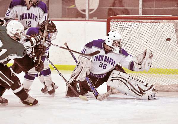 Old Town's Trevor Francis , left, slaps a shot past the glove of Bapst goalie Jaron Leonard (36) in the second period of their game in Bangor Thursday, Jan. 27, 2011. Old Town's Trevor Francis , left, slaps a shot past the glove of Bapst goalie Jaron Leonard (36) in the second period of their game in Bangor Thursday, Jan. 27, 2011.