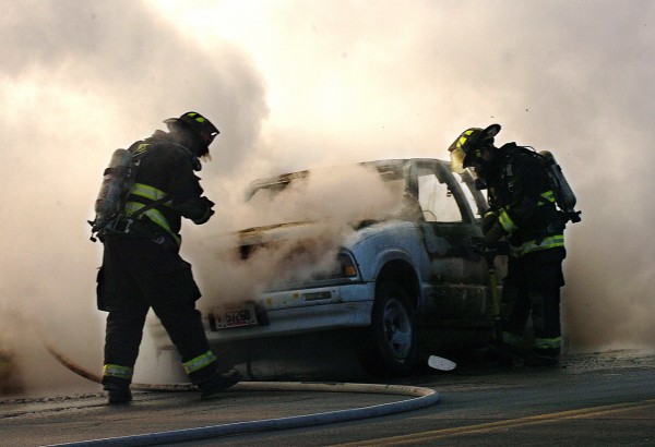 Orono firefighters extinguish a car fire on the off-ramp of Exit 193 of 95 North on Tuesday, January 4, 2011. The 1997 Chevrolet pick-up was being driven by its owner, Mark Calcia of Sorrento, who escaped without injury. "I just heard a big boom and then fire started pouring out," said Calcia. (Bangor Daily News/Kate Collins) Orono firefighters extinguish a car fire on the off-ramp of Exit 193 of 95 North on Tuesday, January 4, 2011. The 1997 Chevrolet pick-up was being driven by its owner, Mark Calcia of Sorrento, who escaped without injury. "I just heard a big boom and then fire started pouring out," said Calcia. (Bangor Daily News/Kate Collins)