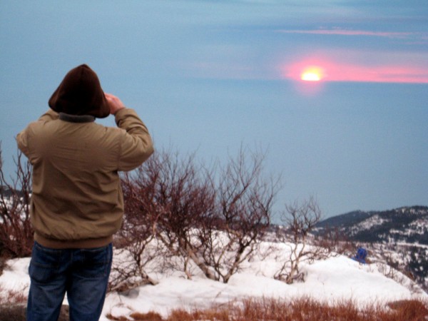 An unidentified hiker on the summit of Cadillac Mountain captures a picture of the sunrise on New Year's Day. Brad Viles photo An unidentified hiker on the summit of Cadillac Mountain captures a picture of the sunrise on New Year's Day. Brad Viles photo