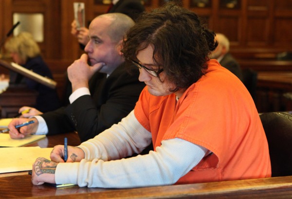 Chad Gurney writes on a pad as he sits in court Monday, Jan. 10, 2011 in Portland, Maine during his trial on charges of strangling his girlfriend 18-year-old Zoe Sarnacki then cutting off her head and setting her body on fire. Prosecutors are saying a 29-year-old Portland man was not insane when he strangled his girlfriend, cut off her head and set her body on fire nearly two years. But defense attorney Sarah Churchill told a judge during Monday's opening statements that Chad Gurney was suffering from a mental disease or defect that prevented from appreciating the wrongfulness of his actions. (AP Photo/Joel Page) Chad Gurney writes on a pad as he sits in court Monday, Jan. 10, 2011 in Portland, Maine during his trial on charges of strangling his girlfriend 18-year-old Zoe Sarnacki then cutting off her head and setting her body on fire. Prosecutors are saying a 29-year-old Portland man was not insane when he strangled his girlfriend, cut off her head and set her body on fire nearly two years. But defense attorney Sarah Churchill told a judge during Monday's opening statements that Chad Gurney was suffering from a mental disease or defect that prevented from appreciating the wrongfulness of his actions. (AP Photo/Joel Page)