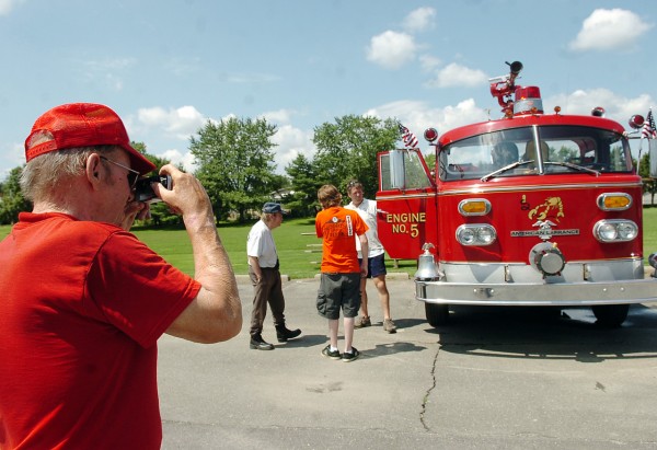 Ron Grant of Hudson takes a photo of Jim Melia's firetruck during the muster and field day hosted by the Pine Tree Chapter of the Society for the Preservation and Appreciation of Motorized and Antique Firefighting Apparatus in America on Saturday in Bangor. (BANGOR DAILY NEWS PHOTO BY KATE COLLINS)
CAPTION
Ron Grant of Hudson takes a photo of one of the antique fire trucks on display during the muster and field day hosted by the Pine Tree Chapter of the Society for the Preservation and Appreciation of Motorized and Antique Firefighting Apparatus in America on Saturday, August 1, 2009, in Bangor. (Bangor Daily News/Kate Collins) Ron Grant of Hudson takes a photo of Jim Melia's firetruck during the muster and field day hosted by the Pine Tree Chapter of the Society for the Preservation and Appreciation of Motorized and Antique Firefighting Apparatus in America on Saturday in Bangor. (BANGOR DAILY NEWS PHOTO BY KATE COLLINS)
CAPTION
Ron Grant of Hudson takes a photo of one of the antique fire trucks on display during the muster and field day hosted by the Pine Tree Chapter of the Society for the Preservation and Appreciation of Motorized and Antique Firefighting Apparatus in America on Saturday, August 1, 2009, in Bangor. (Bangor Daily News/Kate Collins)