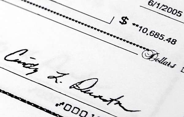 Cindy Dunton's signature is on this town check dated June 1, 2005. It was made out to North County Millworks, the business of her husband, Alan Dunton. The copy of the check was obtained with a Freedom of Information request by concerned Newburgh residents who contend it and other town withdrawals by Cindy Dunton should be added to the $200,000 amount she allegedly embezzled from the Town of Newburgh when she was the deputy treasurer and clerk there. (BDN photo by John Clarke Russ Cindy Dunton's signature is on this town check dated June 1, 2005. It was made out to North County Millworks, the business of her husband, Alan Dunton. The copy of the check was obtained with a Freedom of Information request by concerned Newburgh residents who contend it and other town withdrawals by Cindy Dunton should be added to the $200,000 amount she allegedly embezzled from the Town of Newburgh when she was the deputy treasurer and clerk there. (BDN photo by John Clarke Russ