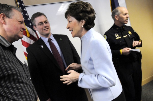 U.S. Sen. Susan Collins, second from right, joined area officials and business leaders at the Bangor Police Dept. for a news conference Tuesday morning to discuss new efforts to raise the federal highway truck weight limit on Maine's highways. Follwing the news conference she chatted with Lincoln Paper and Tissue LLC president and CEO Keith Van Scotter, far left, Brian Parke (Pres. and CEO of the Maine Motor Transport Association), Bangor Police Chief Ron Gastia, far right. U.S. Sen. Susan Collins, second from right, joined area officials and business leaders at the Bangor Police Dept. for a news conference Tuesday morning to discuss new efforts to raise the federal highway truck weight limit on Maine's highways. Follwing the news conference she chatted with Lincoln Paper and Tissue LLC president and CEO Keith Van Scotter, far left, Brian Parke (Pres. and CEO of the Maine Motor Transport Association), Bangor Police Chief Ron Gastia, far right.