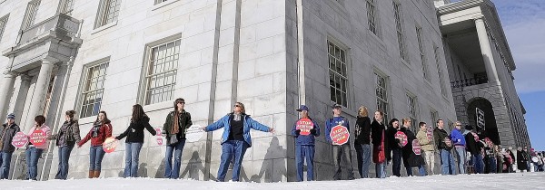 Hundreds of people join hands to form a human chain around the State House on Saturday afternoon during the annual Hands Around the Capitol rally that prompted weekend demonstrations in northern New England capitals. The event recognized the 37th anniversary of the U.S. Supreme Court's decision of Roe v. Wade that legalized abortion. Participants say they're now concerned about health care legislation that would include federal funds for abortion. Hundreds of people join hands to form a human chain around the State House on Saturday afternoon during the annual Hands Around the Capitol rally that prompted weekend demonstrations in northern New England capitals. The event recognized the 37th anniversary of the U.S. Supreme Court's decision of Roe v. Wade that legalized abortion. Participants say they're now concerned about health care legislation that would include federal funds for abortion.