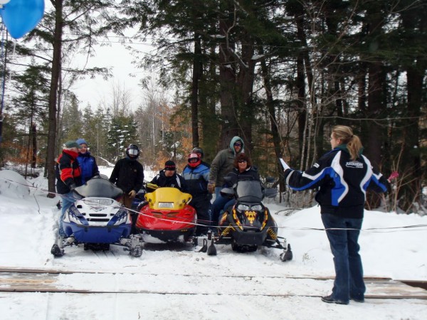 After more than two years of effort, a snowmobile crossing was
approved on the Montreal, Maine & Atlantic Railway tracks on the new Wildwoods Trail in Brownville. A short ceremony was held Saturday at the new crossing which allows snowmobilers to avoid traveling over Schoodic Lake and on camp roads. After more than two years of effort, a snowmobile crossing was
approved on the Montreal, Maine & Atlantic Railway tracks on the new Wildwoods Trail in Brownville. A short ceremony was held Saturday at the new crossing which allows snowmobilers to avoid traveling over Schoodic Lake and on camp roads.