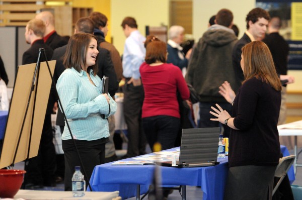 Laura Schnaible (right), staff recruiter for The New England Center for Children in Boston, talks with a UMaine student who declined to be identified on Wednesday during UMaine's Career Fair. Laura Schnaible (right), staff recruiter for The New England Center for Children in Boston, talks with a UMaine student who declined to be identified on Wednesday during UMaine's Career Fair.