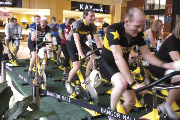 Breast cancer survivor Jeff Bennett of Bangor (second row left), helped to organize a fundraiser Saturday at the Bangor Mall to benefit the Lance Armstrong Foundation. Bennett, who was diagnosed with cancer seven years ago, did three spin classes at center court and during a break said "cancer doesn't have to control your life." Several local celebrities, including WABI meteorologist Todd Simcox (back row left), participated. Breast cancer survivor Jeff Bennett of Bangor (second row left), helped to organize a fundraiser Saturday at the Bangor Mall to benefit the Lance Armstrong Foundation. Bennett, who was diagnosed with cancer seven years ago, did three spin classes at center court and during a break said "cancer doesn't have to control your life." Several local celebrities, including WABI meteorologist Todd Simcox (back row left), participated.