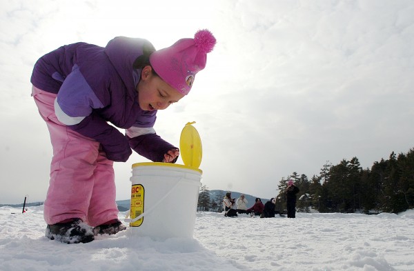 Mikayla McMullen, 8, of Orrington, examines the ice fishing bait during the first of several winter camping days at Camp CaPella in Lucerne on Saturday. Mikayla attends Camp Capella, which is located on Phillips Lake and devoted to both children and adults with developmental disabilities in the summer, but this is her first time winter camping. "I love it here," she said. Mikayla McMullen, 8, of Orrington, examines the ice fishing bait during the first of several winter camping days at Camp CaPella in Lucerne on Saturday. Mikayla attends Camp Capella, which is located on Phillips Lake and devoted to both children and adults with developmental disabilities in the summer, but this is her first time winter camping. "I love it here," she said.